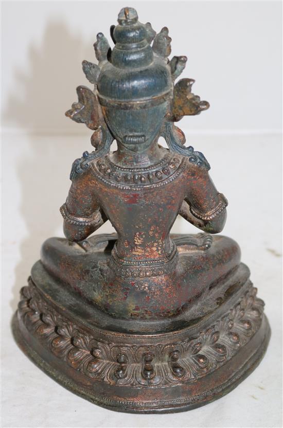 A Sino-Tibetan lacquered bronze seated figure of a Bodhisattva, 16th/17th century, height 23cm